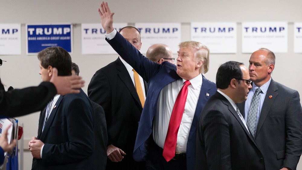 Republican presidential candidate Donald Trump waves to guests as he leaves a rally at Des Moines Area Community College Newton Campus on Nov. 19, 2015 in Newton, Iowa. (Photo by Scott Olson/Getty)