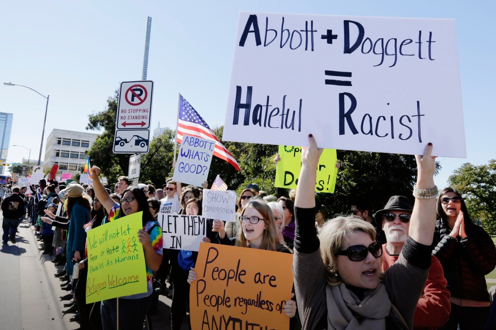 Members of The Syrian People Solidarity Group protest on Nov. 22, 2015 in Austin, Texas. (Photo by Erich Schlegel/Getty)
