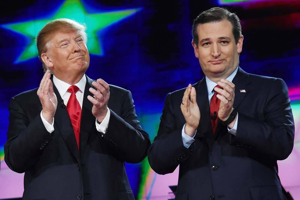 Republican presidential candidates Donald Trump and Sen. Ted Cruz applaud as they are introduced during the CNN presidential debate at The Venetian Las Vegas on Dec. 15, 2015 in Las Vegas, Nev. (Photo by Ethan Miller/Getty)