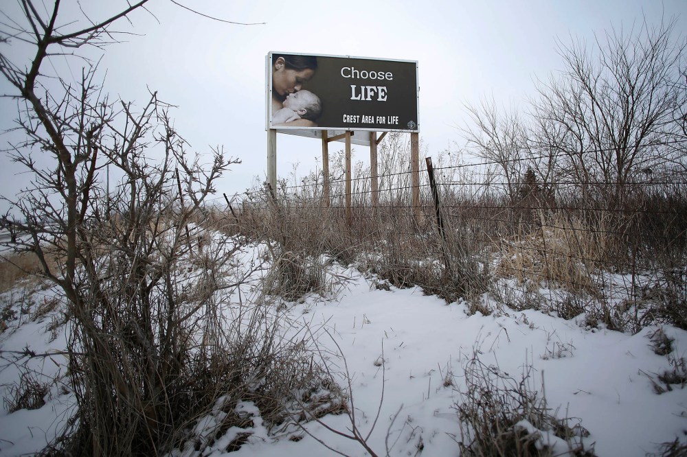 A "Chose Life" advertisement is displayed along a snow covered U.S. Highway 34 on Jan. 22, 2016 in Thayer, Iowa. (Photo by Joshua Lott/Getty)