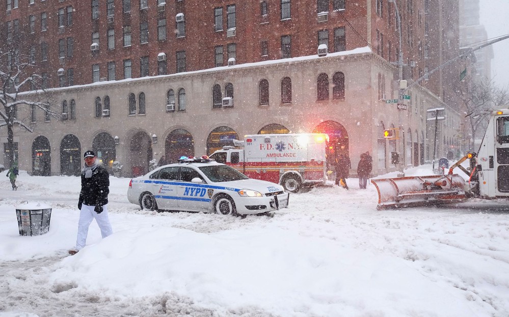 Emergency Vehicles in the empty streets in Chelsea during blizzard conditions on Jan. 23, 2016 in New York. (Photo by Jamie McCarthy/Getty)