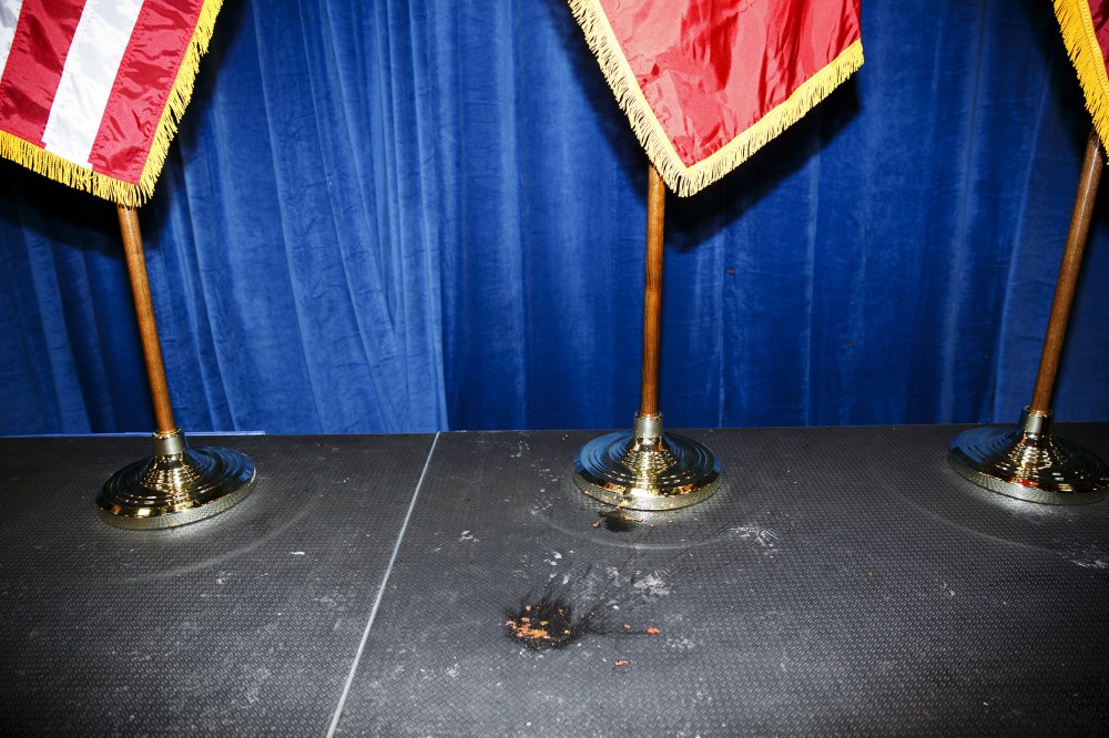 The remains of a tomato thrown by a protester at Donald Trump lies on the ground during an event in Iowa City, Iowa, on Jan. 26, 2016. (Photo by Patrick T. Fallon/Bloomberg/Getty)