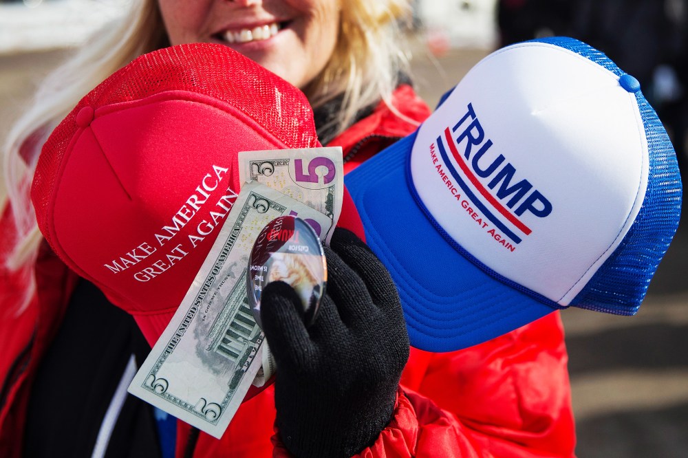 A vendor sells merchandise outside a rally for Republican presidential candidate Donald Trump at the airport on Jan. 29, 2016 in Dubuque, Iowa. (Photo by Scott Olson/Getty)