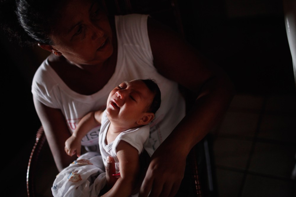 Alice Vitoria Gomes Bezerra, a 3-months-old with microcephaly, and mother Nadja Cristina Gomes Bezerra, Jan. 31, 2016 in Recife, Brazil. There are an estimated 4,000 infants with microcephaly related to Zika virus in Brazil. (Photo by Mario Tama/Getty)