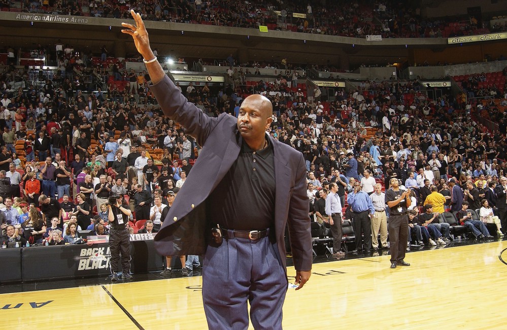 NBA Legend Moses Malone salutes the crowd during the NBA Legends tour's stop in Game four of the Eastern Conference Semifinals during the 2004 NBA Playoffs at the American Airlines Arena, on May 12, 2004 in Miami. (Photo by Issac Baldizon/NBAE/Getty)