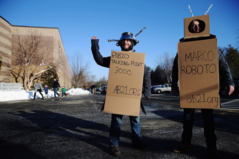 Workers from the American Bridge 21st Century super PAC wear robot costumes outside a Sen. Marco Rubio (R-FL) town hall in Londonderry, N.H., Feb. 7, 2016. (Photo by Chip Somodevilla/Getty)