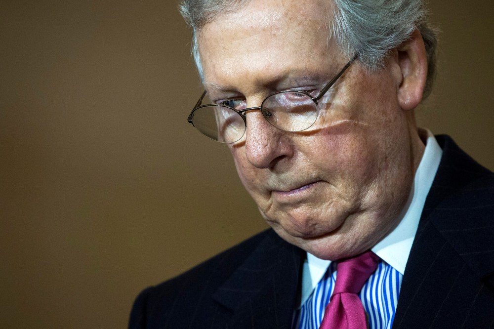 Senate Majority Leader Mitch McConnell (R-KY) bows his head in prayer during an event on Capitol Hill, Feb. 24, 2016 in Washington, D.C. (Photo by Drew Angerer/Getty)