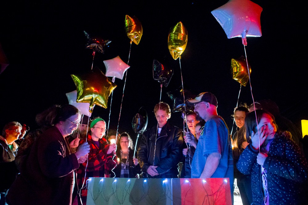 Family and friends hold a candle light vigil on Hesston Road for shooting victim Brian Sadowsky outside the Excel Industries plant on Feb. 26, 2015 in Kansas. (Photo by Kyle Rivas/Getty)