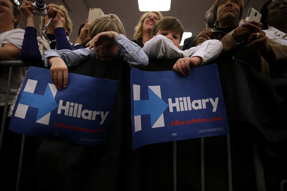 Young supporters hold signs as Hillary Clinton speaks during a "Get Out The Vote" event at Meharry Medical College on Feb. 28, 2016 in Nashville, Tenn. (Photo by Justin Sullivan/Getty)