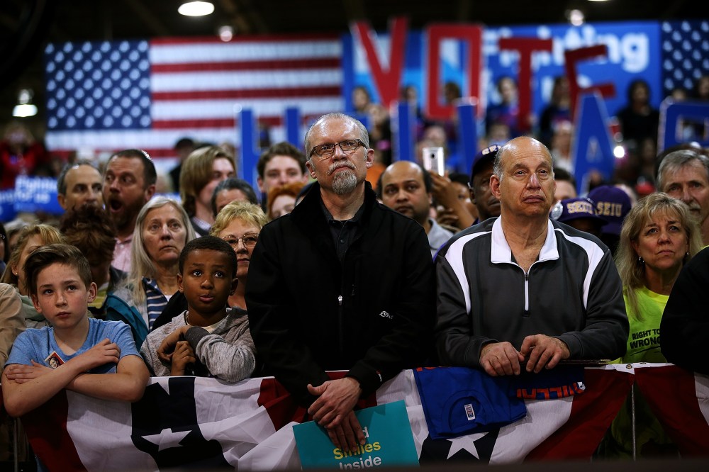 Supporters look on as Hillary Clinton speaks during a Get Out the Vote event at the Nelson-Mulligan Carpenters' Training Center on March 12, 2016 in St Louis, Mo. (Photo by Justin Sullivan/Getty)