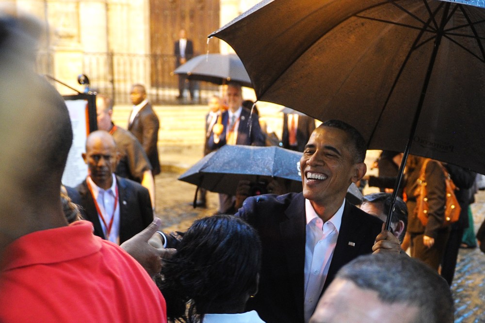 President Barack Obama talks to tourists and Cubans at his arrival to the Havana Cathedral, on March 20, 2016. (Photo by Yamil Lage/AFP/Getty)