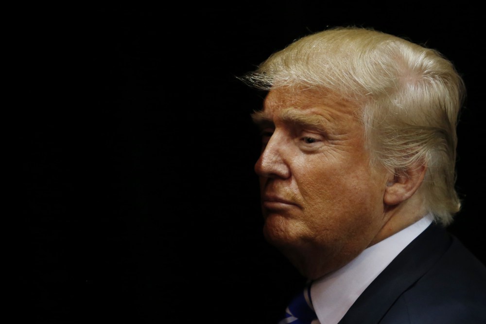 Republican presidential candidate Donald Trump exits the arena after speaking at a campaign rally on April 11, 2016 in Albany, New York. (Photo by Eduardo Munoz Alvarez/Getty)