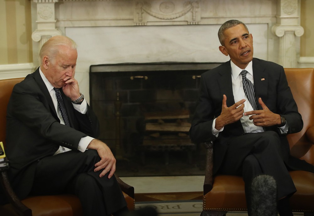 President Obama is flanked by Vice President Biden as he speaks to the media about the Zika virus, after receiving a briefing from his public health team in the Oval Office at the White House, May 20, 2016 in Washington, DC. (Photo by Mark Wilson/Getty)