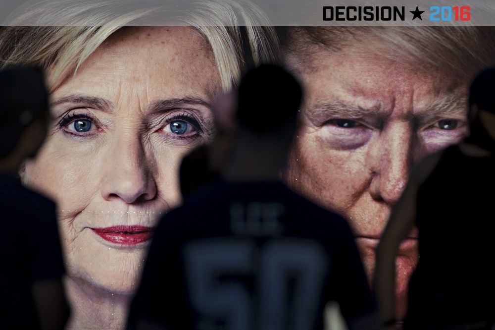 A group of Hofstra University students stand in front of a CNN trailer with images of Hillary Clinton and Donald Trump at Hofstra University, Sept.25, 2016, in Hempstead, N.Y. (Photo by Andrew Harrer/Bloomberg/Getty)