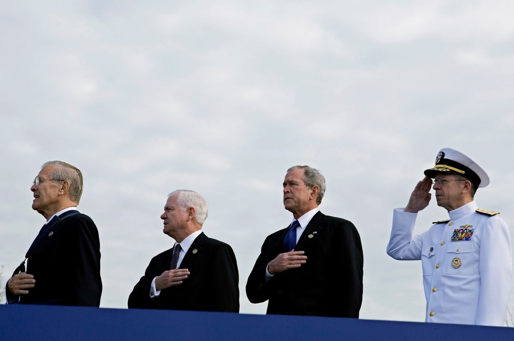 Former U.S. Secretary of Defense, Donald Rumsfeld, U.S. Secretary of Defense Robert Gates, U.S. President George W. Bush and Chairman of the Joint Chiefs of Staff Michael Mullen at the Pentagon Memorial, Sept. 11, 2008. (Photo by Joshua Roberts/Getty)