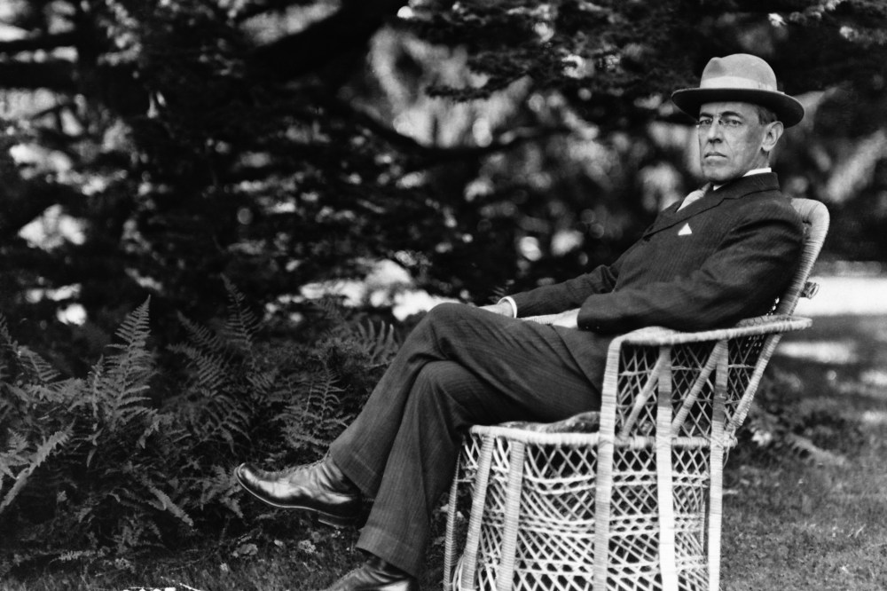 Full length portrait of American President Woodrow Wilson seated outdoors, circa 1920. (Photo by Fotosearch/Getty)