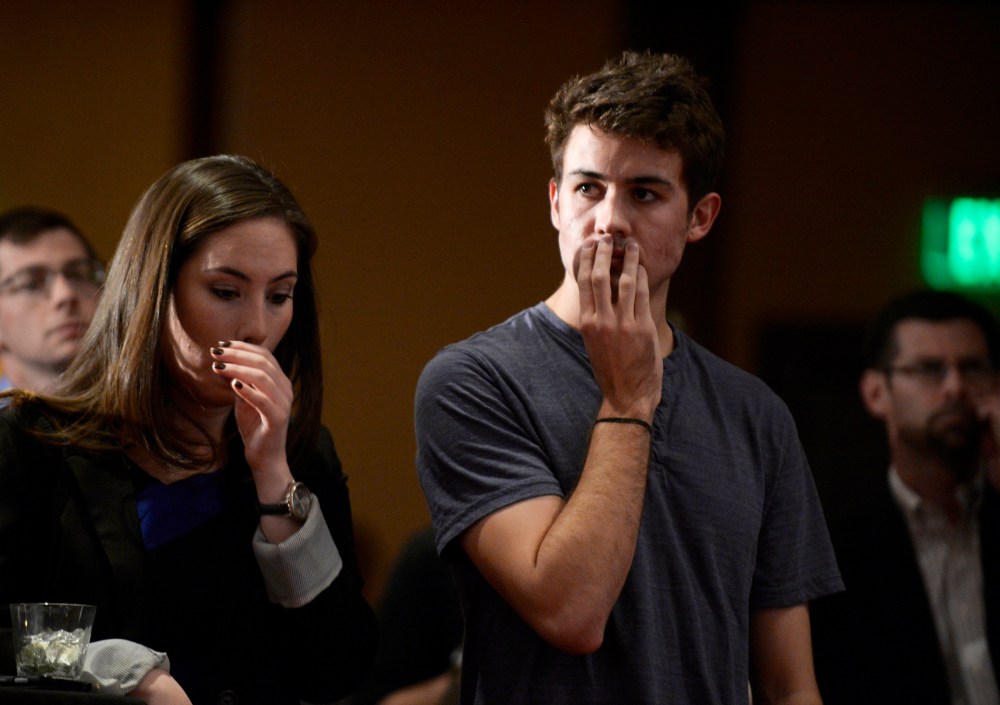 Campaign volunteer Dylan Saunders, right, listens to comments by Sen. Mike Johnston during a watch party for supporters of Amendment 66 at the Marriott City Center in Denver, CO November 05, 2013.