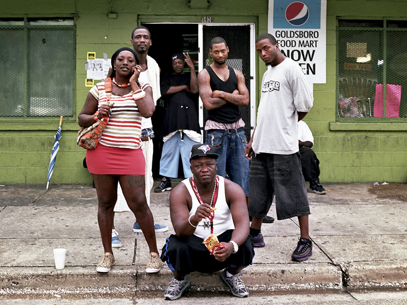 Goldsboro residents pose for a portrait in front of Goldsboro Food Mart, a popular local hangout, located on 13th Street, the town’s main artery, June, 2013.