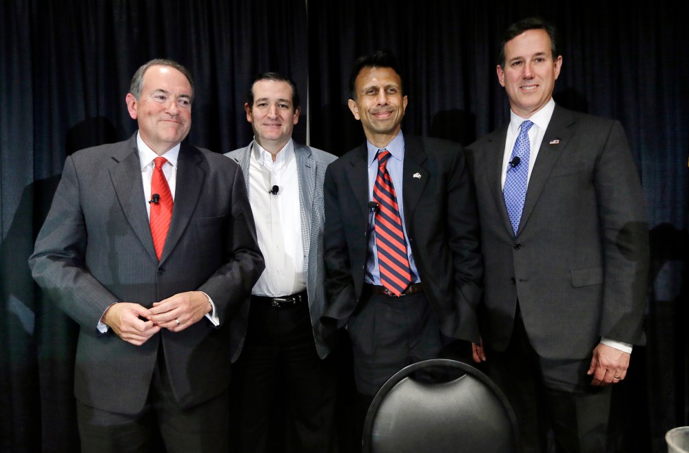 Former Arkansas Gov. Mike Huckabee, from left, Sen. Ted Cruz, R-Texas, Louisiana Gov. Bobby Jindal and former Pennsylvania Sen. Rick Santorum gather on stage after speak at the Homeschool Iowa's Capitol Day, Thursday, April 9, 2015, in Des Moines, Iowa.