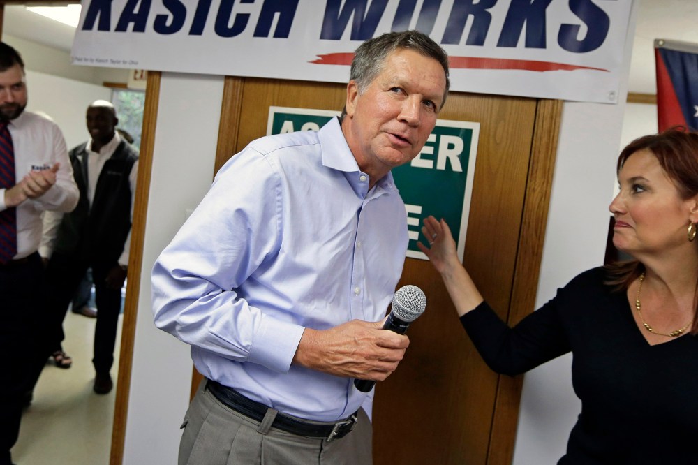 Ohio Gov. John Kasich is introduced by Lt. Gov. Mary Taylor during a rally at Darke County GOP headquarters, on Oct. 13, 2014, in Greenville, Ohio.