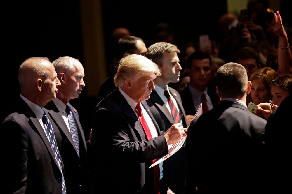 Republican Presidential candidate Donald Trump signs autographs at a rally in Raleigh, N.C., July 5, 2016. (Photo by Gerry Broome/AP)