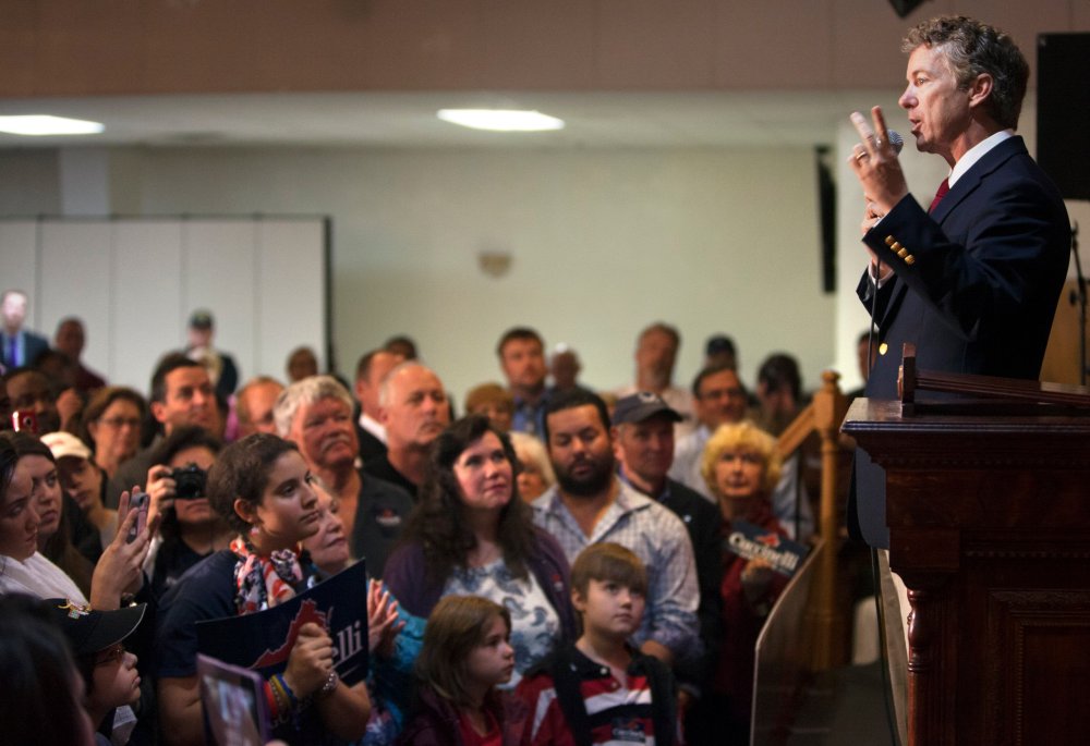 Sen. Rand Paul, R-KY,  introduces Virginia Attorney General Ken Cuccinelli at the Philippine Culture Center in Virginia Beach, Va., Monday, Oct. 28, 2013.