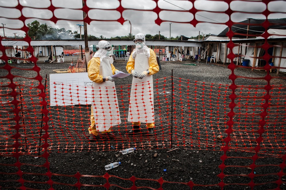 Doctors inside the high-risk area of the the Ebola Treatment Unit of Doctors without Borders in Monrovia, Liberia on Oct. 6th, 2014. (Photo by Daniel van Moll/Laif/Redux)