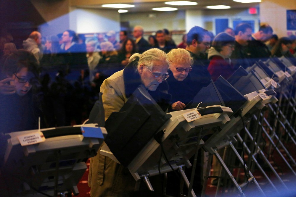 Voters cast ballots inside a polling station at Cross Community Church in Elyria, Ohio, on Election Day, Nov. 6, 2012.