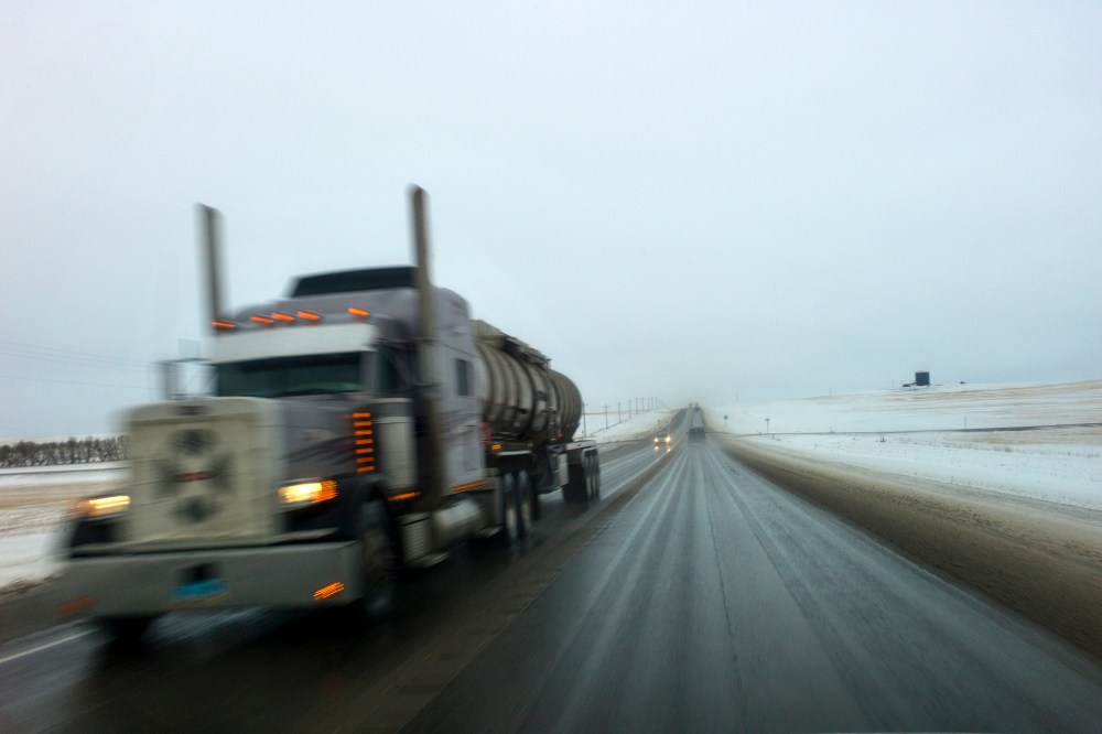 An oil tanker drives down a road near Watford City, North Dakota.