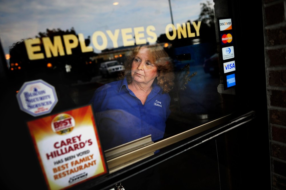 A waitress looks outside in Savannah, Ga., Oct. 28, 2013.