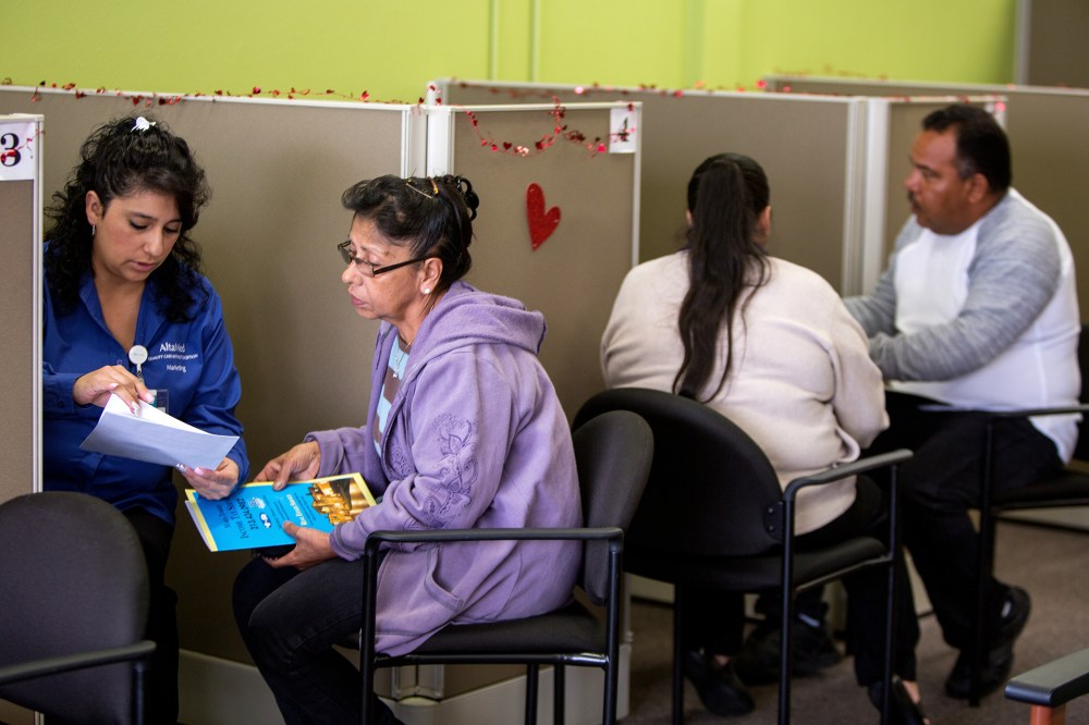 Jesica Arias, meets with clients at AltaMed Resource Center to guide them through applying for insurance under the Affordable Care Act in Commerce, Calif., Jan. 30, 2014.