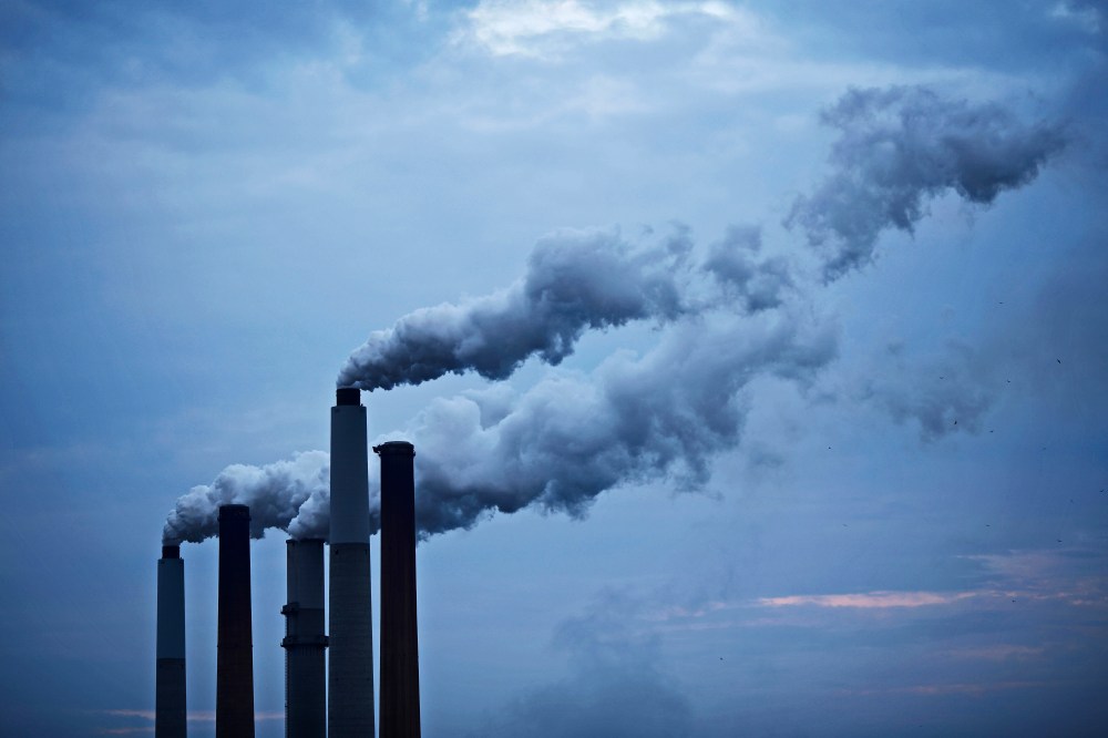 Emissions from a coal-fired power plant drift skyward in Ghent, Ky., June 2, 2014.