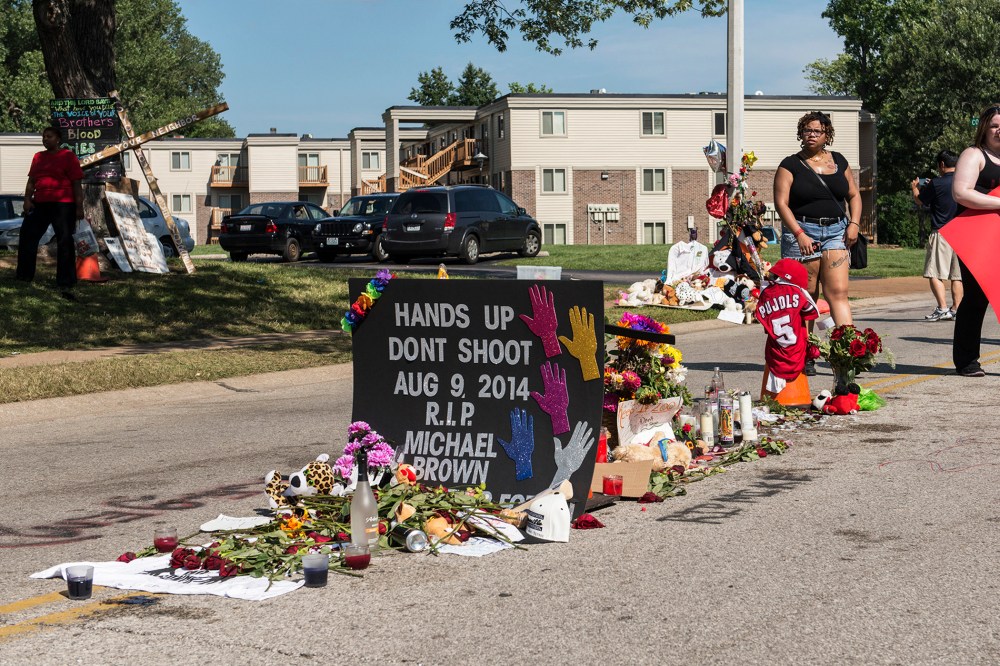 A small memorial marks the place where Michael Brown's body fell after being killed by a police officer in Ferguson, Mo.