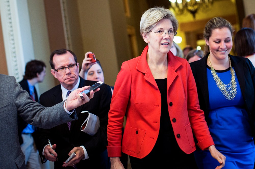 Sen. Elizabeth Warren (D-Mass.) exits a Democratic caucus meeting on Capitol Hill in Washington, Nov. 13, 2014. (Photo by Drew Angerer/The New York Times/Redux)