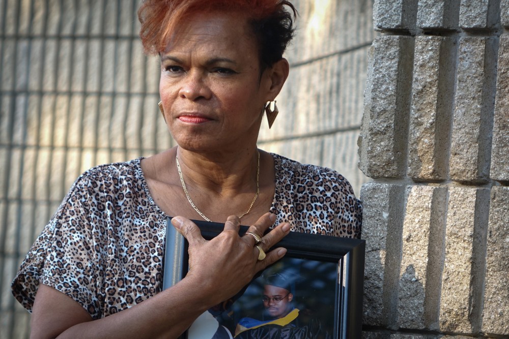 Jennifer Young, mother of Jermaine McBean, hold a photo of her son of when he received a computer-engineering degree, in Oakland Park, Fla., March 18, 2015. (Photo by Angel Valentin/The New York Times/Redux)