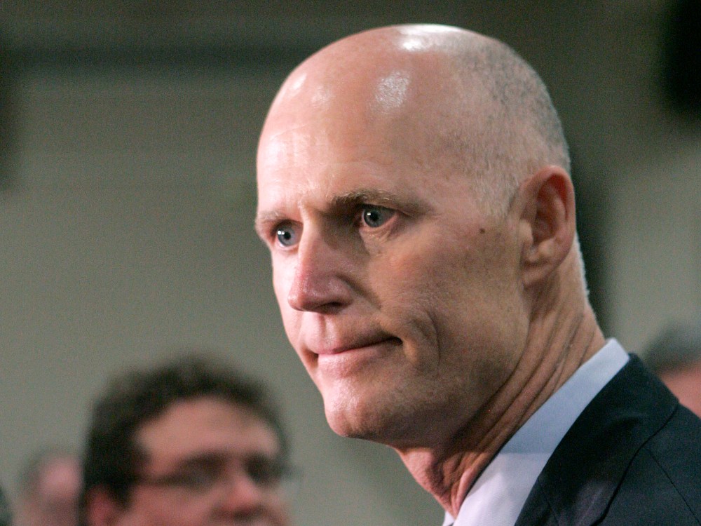 File Photo: Gov. Rick Scott expresses his disappointment about the supreme court's decision concerning the health care bill at a news conference on Thursday, June 28, 2012, in Tallahassee, Fla. (Photo by Steve Cannon/AP Photo File)