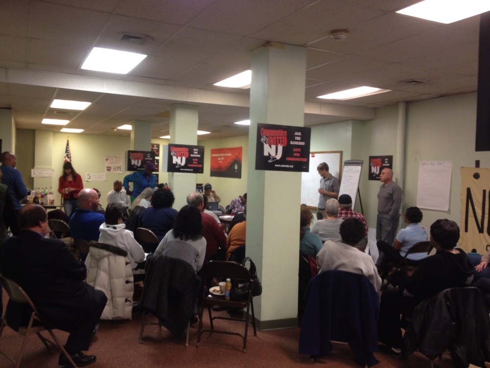 People gather at a Saturday morning meeting hosted by New jersey Communities United in Newark, NJ on December 7, 2013.