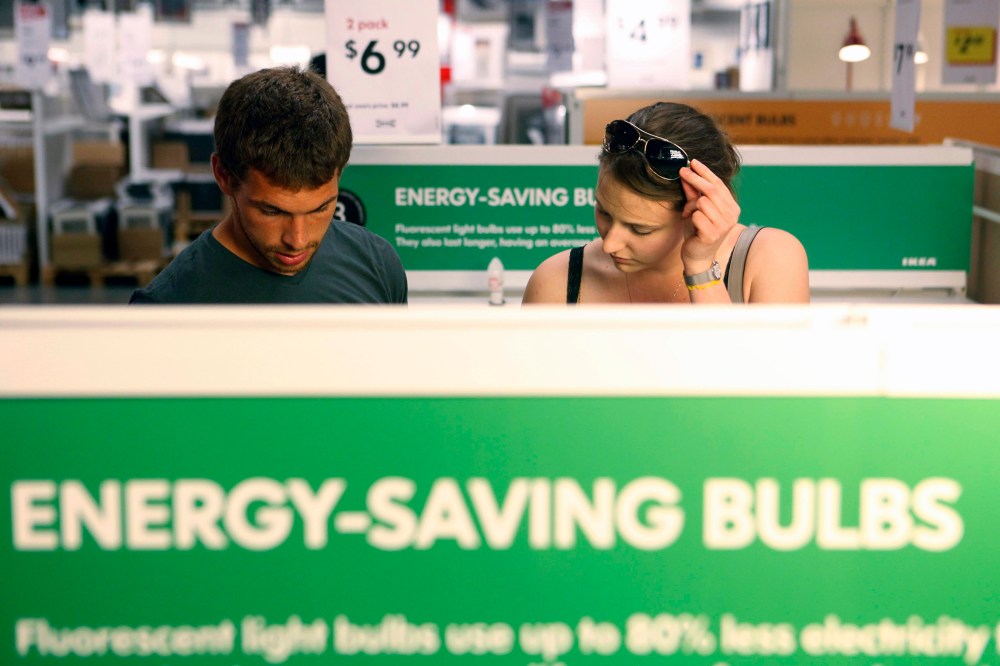 Joe Mozloom and Allison Roethke shop for compact fluorescent bulbs at an Ikea store in Philadelphia, Tuesday, June 15, 2010.