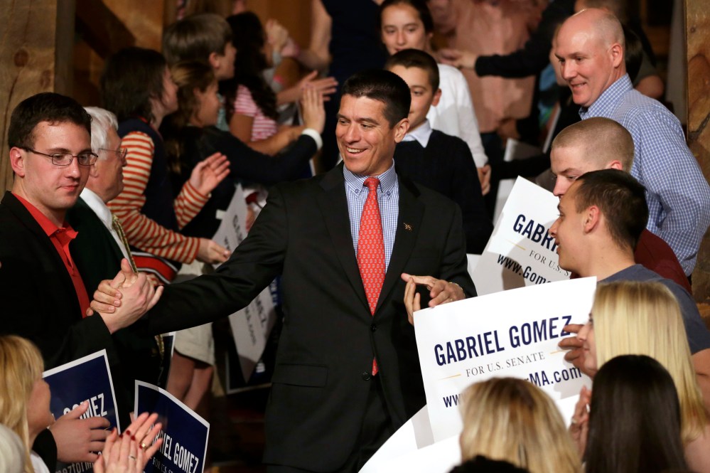 Republican candidate for the U.S. Senate, Gabriel Gomez, center, celebrates with supporters as he makes his way to the stage to address an audience with a victory speech at a watch party, in Cohasset, Mass. (AP Photo by Steven Senne/AP)