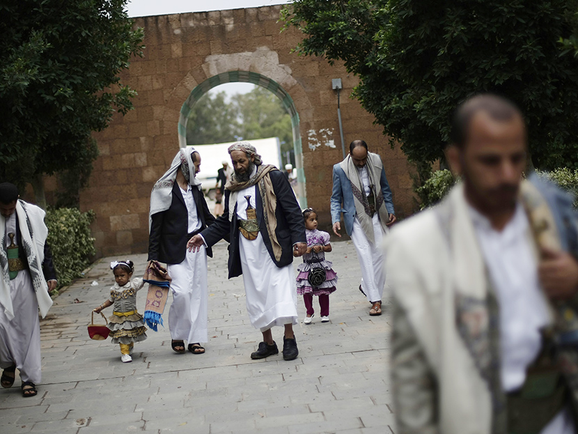 Yemenis gather after Eid al-Fitr prayers that marks the end of the holy fasting month of Ramadan on the first day of Eid al-Fitr in Sanaa, Yemen, Thursday, Aug. 8, 2013. (Photo by Hani Mohammed/AP)