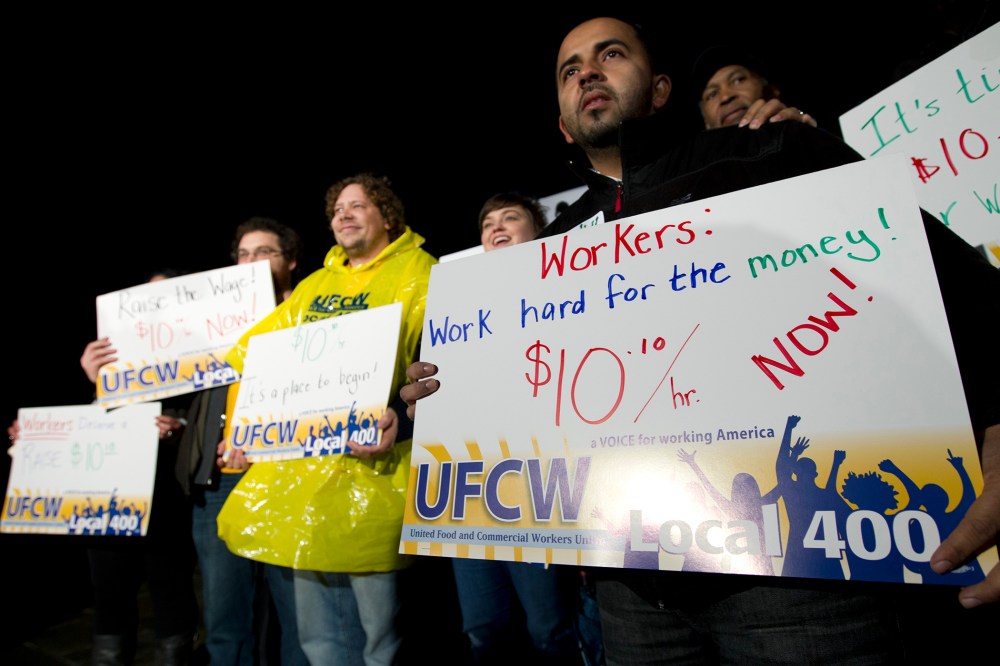 Demonstrators hold up their banners during a rally outside of the Maryland State House in Annapolis, Md, on Tuesday Jan. 14, 2014.