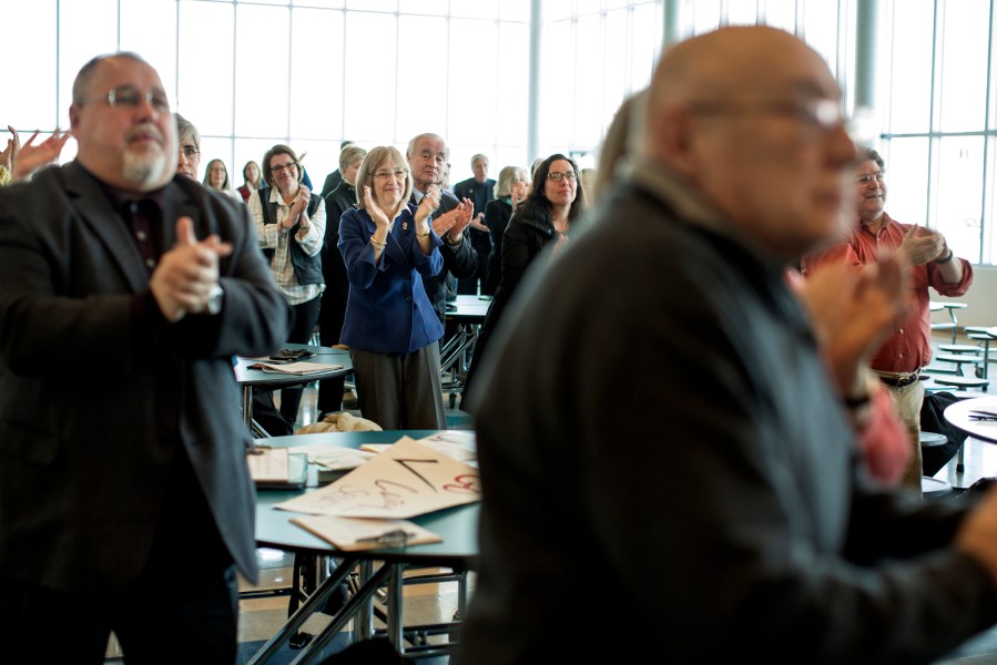 People listen as Shenna Bellows, speaks to the Falmouth Democratic town caucus on March 3, 2014.