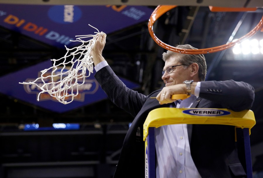 Connecticut head coach Geno Auriemmac celebrates by cutting down the net following the championship game against Syracuse at the women's Final Four in the NCAA college basketball tournament Tuesday, April 5, 2016, in Indianapolis. (Photo by AJ Mast/AP)
