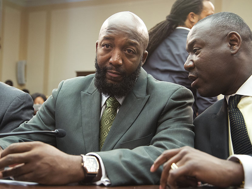 Tracy Martin, father of Trayvon Martin, left, talks to his attorney Benjamin Crump, on Capitol Hill in Washington, Wednesday, July 24, 2013, during a forum entitled "The Status of Black Males: Ensuring Our Boys Mature Into Strong Men."   (Photo by...
