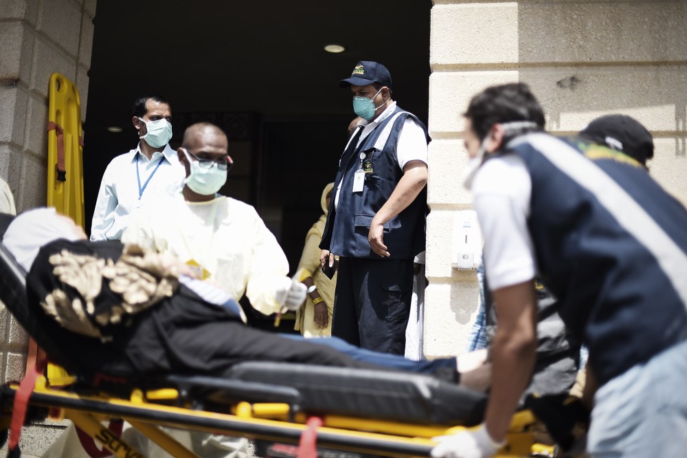 Saudi medics tend to injured pilgrims after they arrived at an emergency hospital following a deadly stampede in Mina, near the holy city of Mecca, on the first day of Eid al-Adha on Sept. 24, 2015. (Photo by Mohammed Al-Shaikh/AFP/Getty)