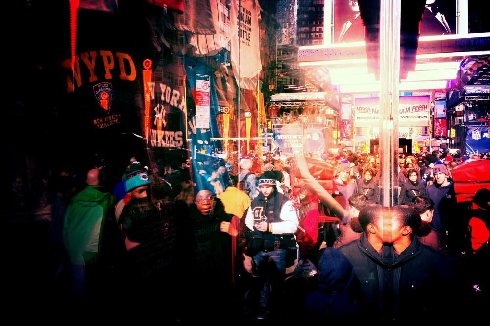 A women is seen entering a store around Time Square, New York City.