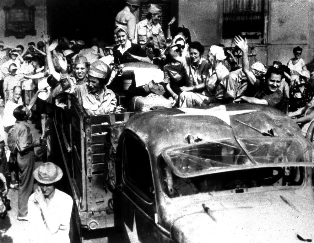 U.S. army nurses, interned since the fall of Corregidor in 1942, wave goodbye to fellow inmates at Santo Tomas, a former Japanese prison camp, in Manila, the Philippines, April 18, 1945. The nurses are returning to their homes and families in the...