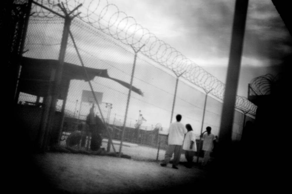 Detainees in camp 4 of Guantanamo Bay in June 2006. (Photo by Paolo Pellegrin/Magnum Photos)