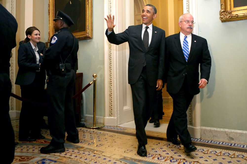 President Barack Obama gestures as he speaks to workers about the economy during a visit to Daimler Detroit Diesel in Redford, Mich., Monday, Dec. 10, 2012. (AP Photo/Paul Sancya)