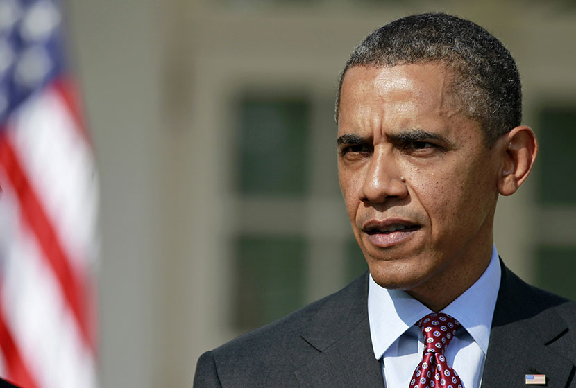 President Barack Obama answers a reporter's  question about the death of Trayvon Martin, Friday, March 23, 2012,  in the Rose Garden of the White House in Washington. (Photo by Haraz N. Ghanbari/AP)
